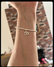 Sterling silver bracelet with Ohm charm