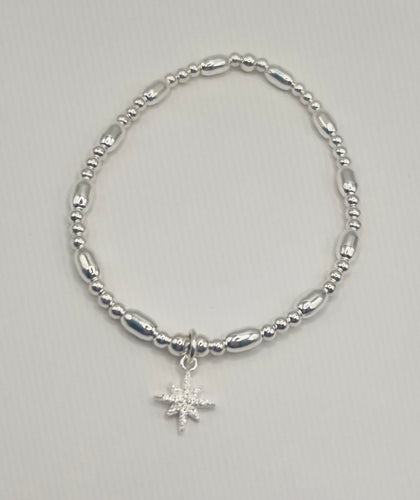 Sterling silver oval spacer with North star charm