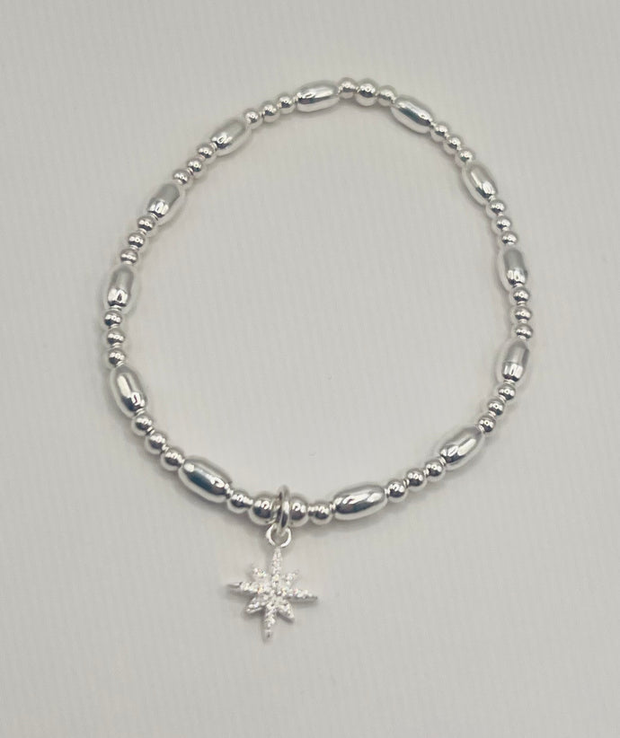 Sterling silver oval spacer with North star charm