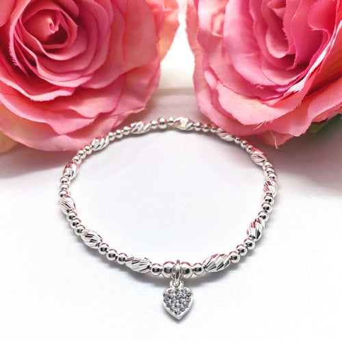 Sterling silver sparkly oval bead and smooth round bead with crystal heart