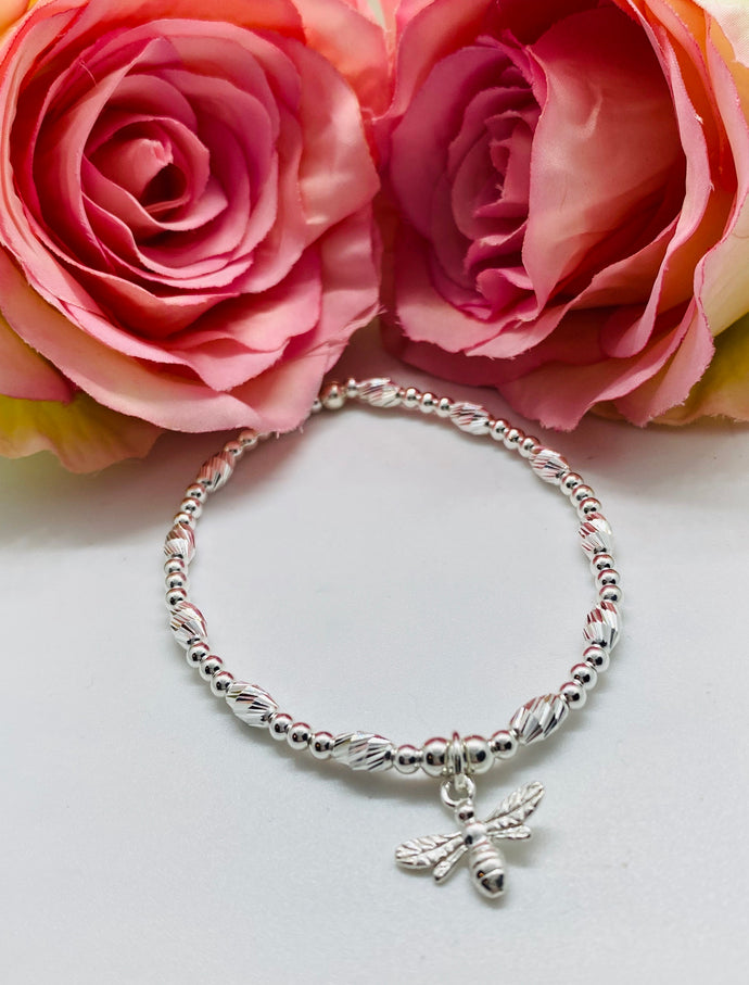 Crystal cut oval spacer bracelet with Bee charm