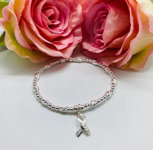 Crystal cut oval spacer bracelet with cancer charm