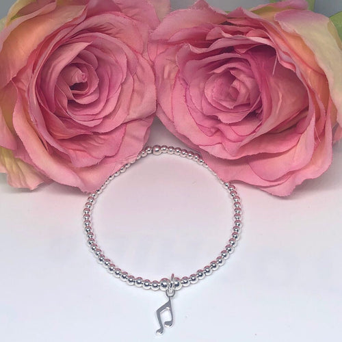 Sterling silver bracelet with musical note charm
