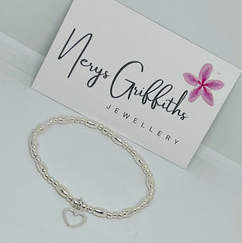 Sterling silver oval spacer with open heart bracelet