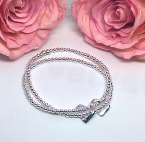 Sterling silver double strand bracelet with 2 ribbon hearts