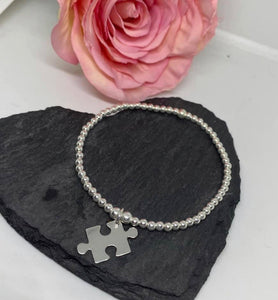 Sterling silver classic bracelet with jigsaw charm