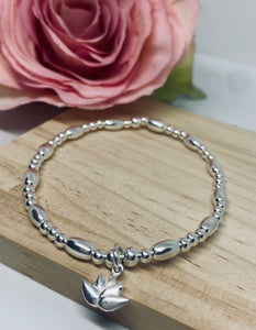 Sterling silver oval spacer bracelet with lotus flower