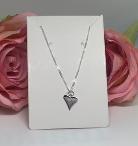 Sterling silver necklace with pointy heart charm