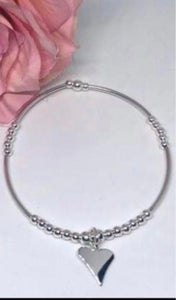 Sterling silver long spacer with pointy heart charm
