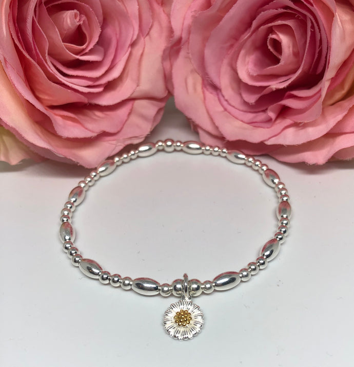 Sterling silver oval spacer daisy charm bracelet
