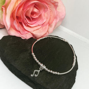Sterling silver long spacer bracelet with musical note charm
