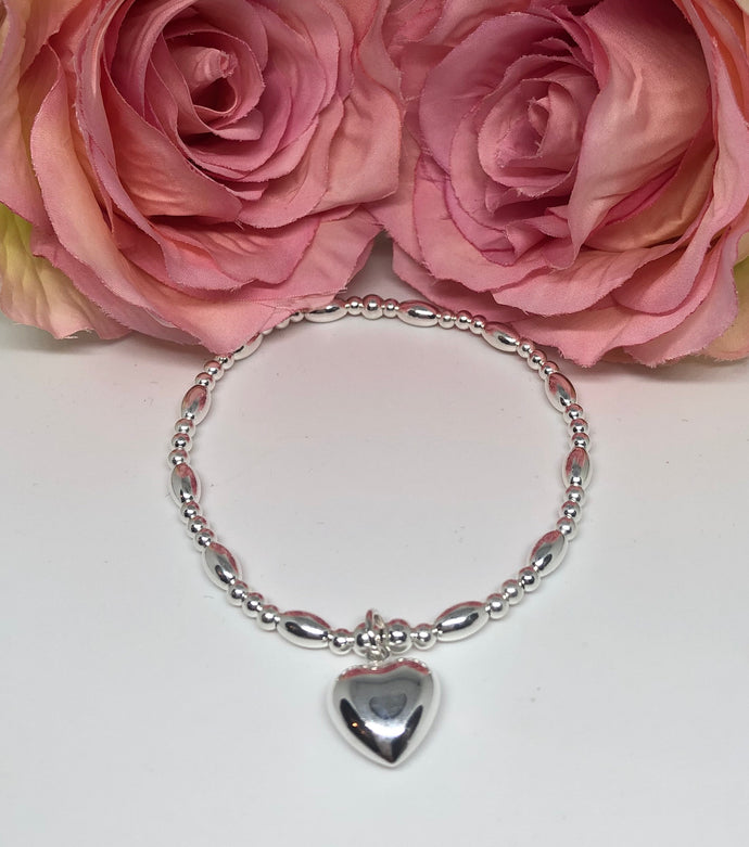 Sterling silver oval spacer with chunky heart