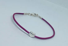 Leather surf bracelet with heart in fuchsia