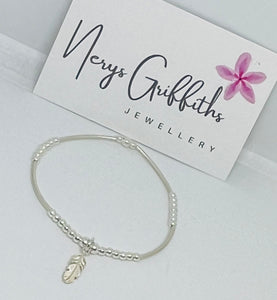 Sterling Silver Spacer Bracelet with Feather Charm