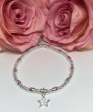 Sterling silver oval spacer with crystal star charm