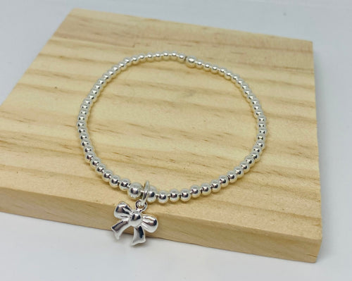 Sterling silver bracelet with Bow charm