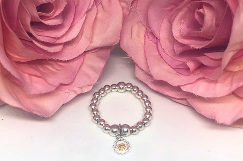 Sterling silver ring with daisy charm